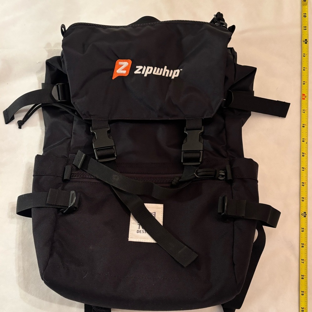 Topo Designs Black Rover Backpack logo